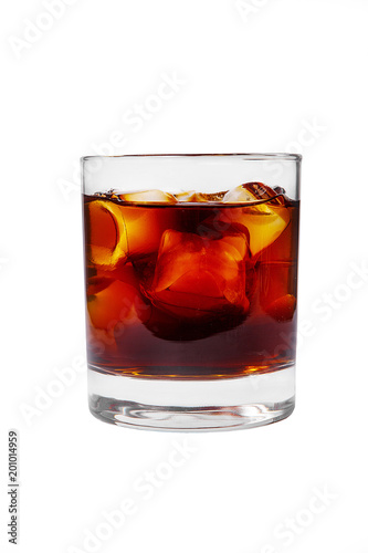 A single-colored transparent cocktail, refreshing in a low glass with radiant ice cubes with a taste of berries, cherries, strawberries, grapefruit, cola. Side view Isolated white background