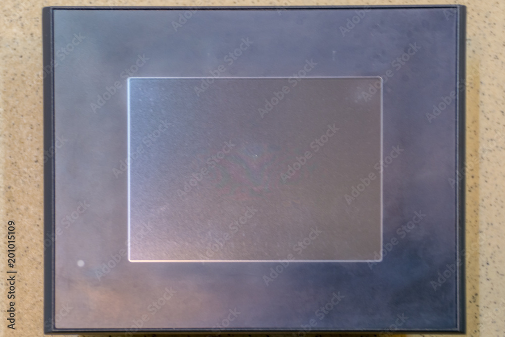 Fototapeta premium Touch panel. Black LCD screen on the stone texture.