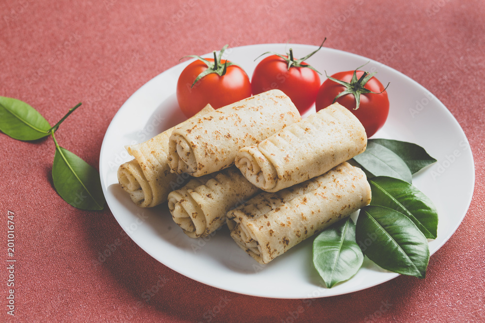 pancakes stuffed rolled with tomatoes