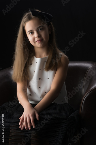 Little girl on a black background © lotosfoto