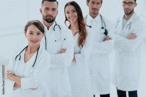 woman-pediatrician on the background of colleagues