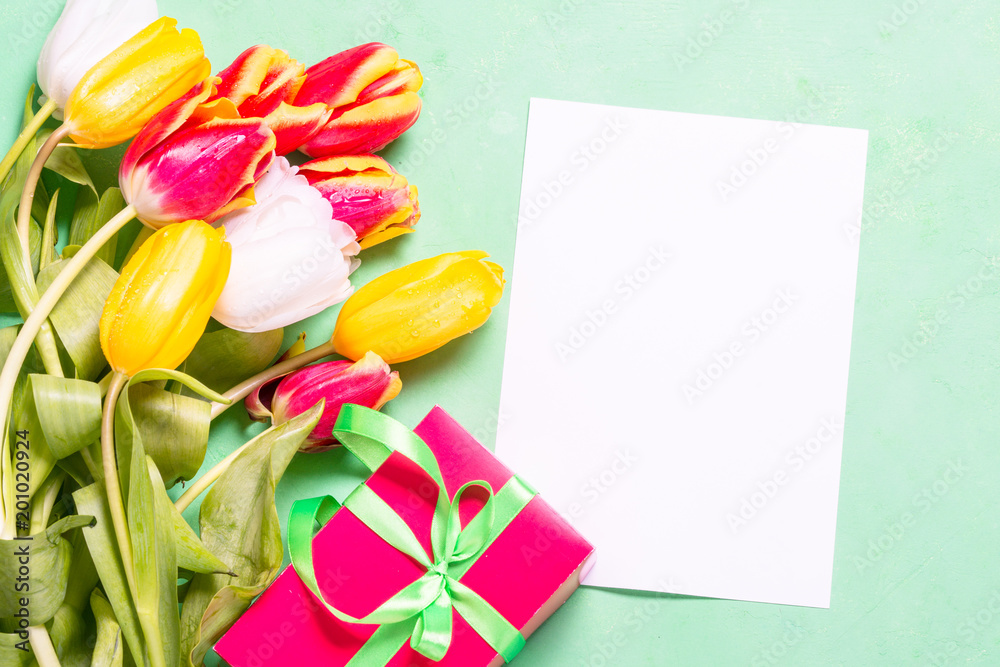 Holiday background or greeting card. Flower and present box.