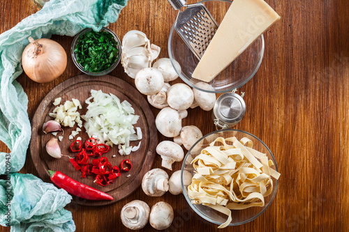 Ingredients ready for prepare tagliatelle pasta with champignon