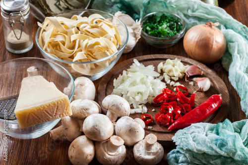 Ingredients ready for prepare tagliatelle pasta with champignon