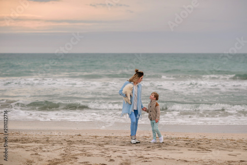Mom and son on the beach.