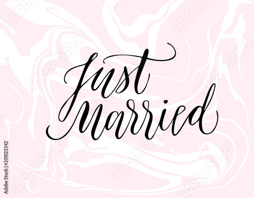 Just married calligraphy on pink marbled background.