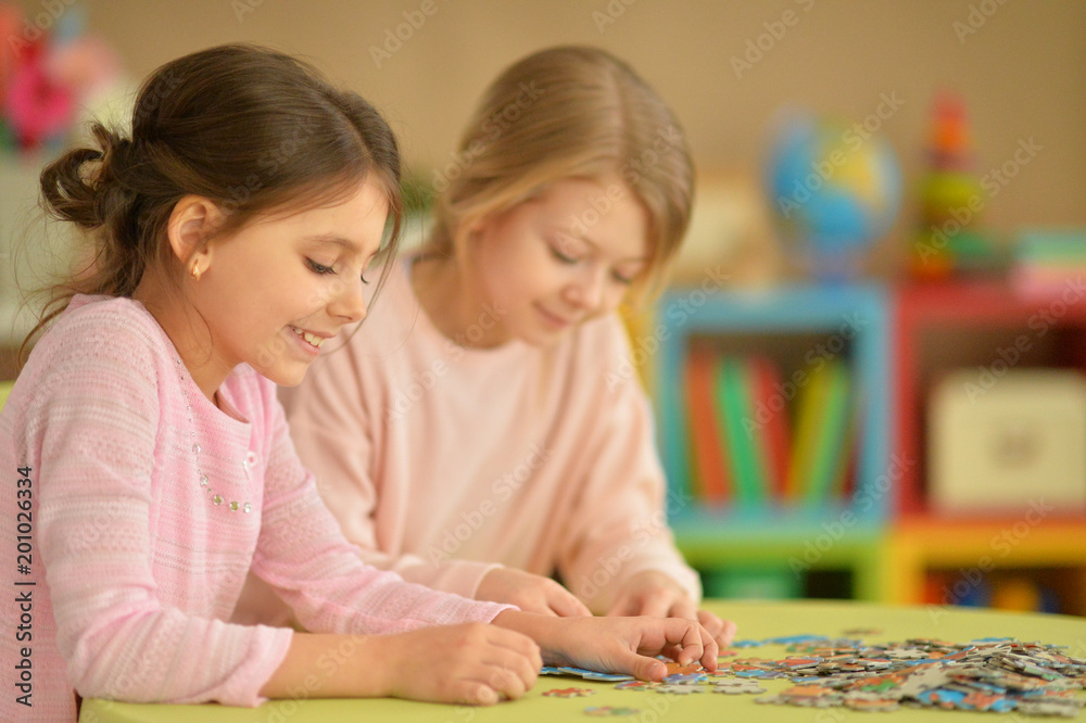 Girls collecting puzzles Girls collecting puzzles
