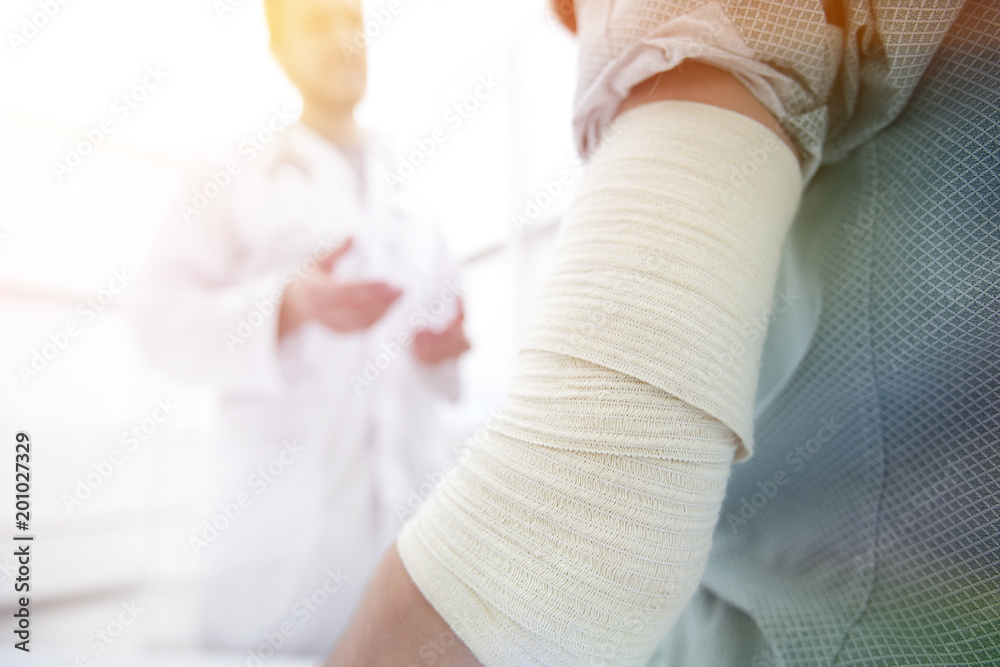 orthopedist talking with the patient.