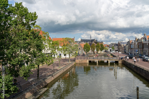 Cityscape of Sneek at the Balthuskade and Prinsengracht (Canal) and the Rienck Bockemakade seen from the Waterpoort (Water gate) in the province Friesland, The Netherlands