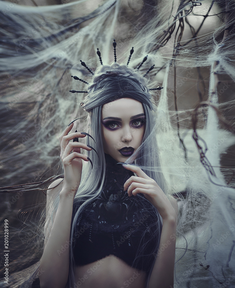 Beautiful sexy Gothic girl with pale skin and long white hair like spider  black widow in