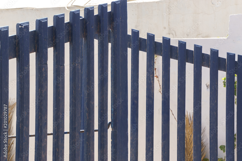 The wooden gate of the fence