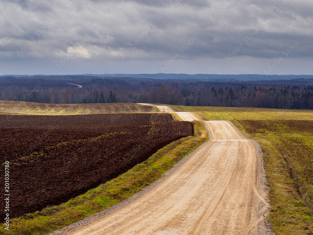 Rural gravel road in autumn Rural gravel road in autumn