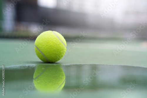 Reflection of tennis ball in water on the court background © WK Stock Photo 