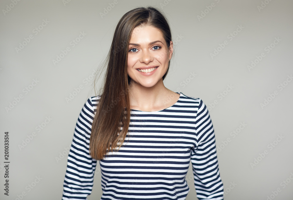 Smiling girl wearing striped shirt isolated studio portrait. Smiling girl wearing striped shirt isolated studio portrait.
