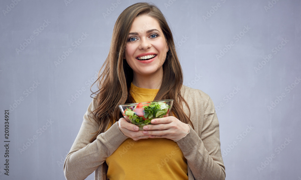 Beautiful smiling girl holding salad bowl. Beautiful smiling girl holding salad bowl.