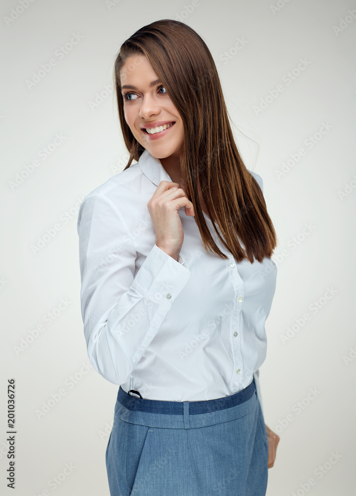 Smiling businesswoman wearing white shirt looking back. Smiling businesswoman wearing white shirt looking back.