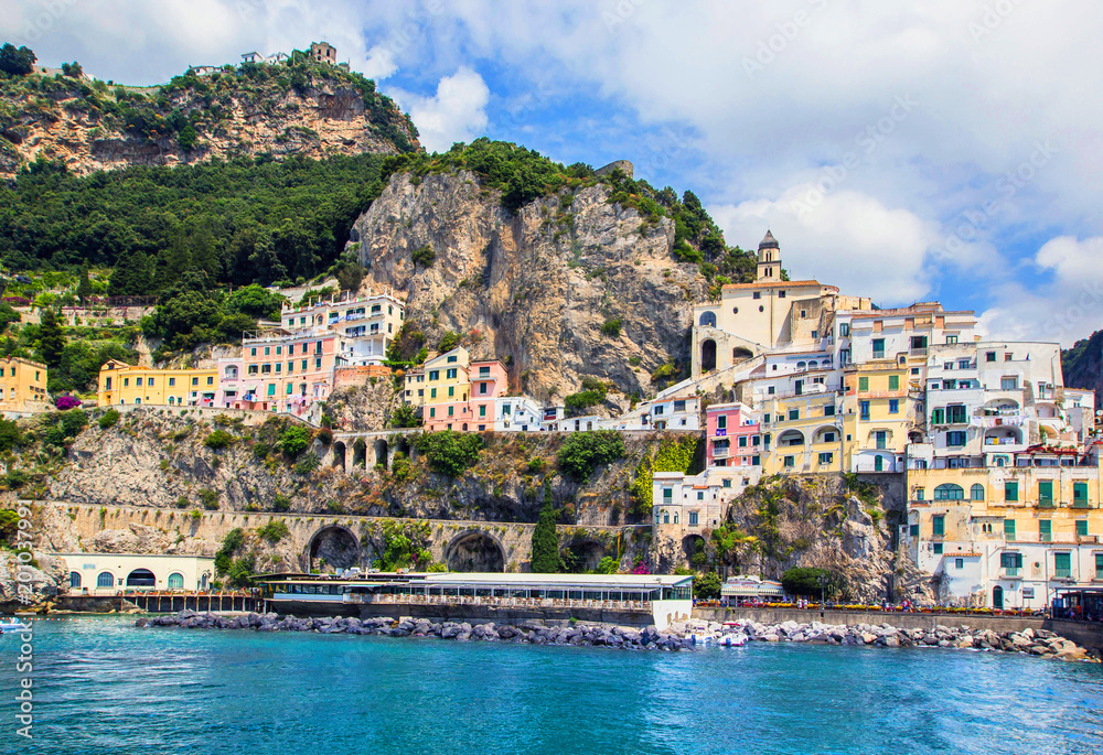 Wonderful Italy. Small haven of Amalfi village with turquoise sea and colorful houses on slopes of Amalfi Coast with Gulf of Salerno, Campania, Italy.