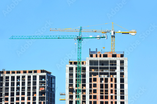 Crane and highrise construction site