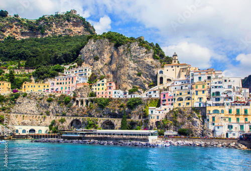 Fototapeta Naklejka Na Ścianę i Meble -  Wonderful Italy. Small haven of Amalfi village with turquoise sea and colorful houses on slopes of Amalfi Coast with Gulf of Salerno, Campania, Italy.