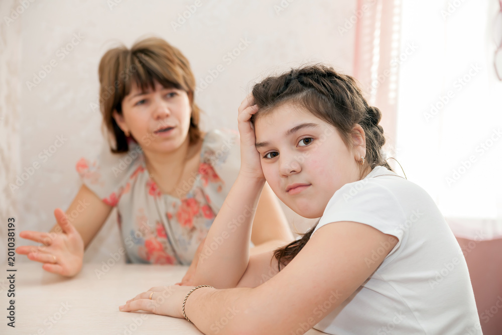 Furious mother scolding schoolgirl Furious mother scolding schoolgirl