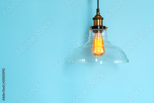 Photography Lamp incandescence in a modern glass ceiling on a blue background