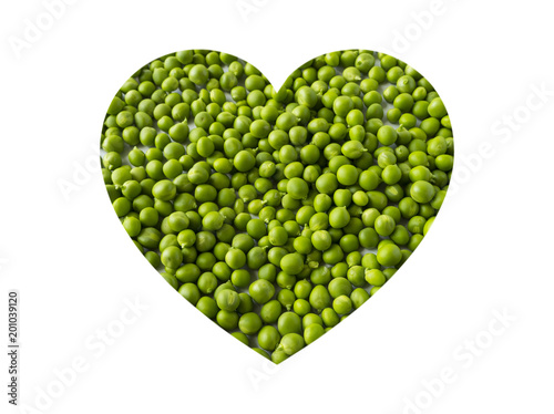 Green peas in heart shape isolated on a white. Vegetables with copy space for text. Top view.