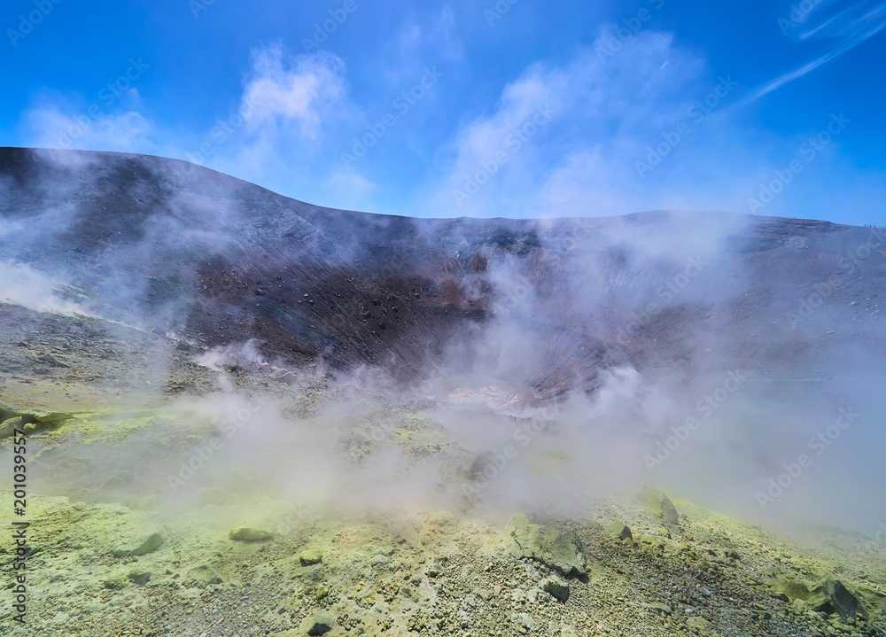 Sulphur gas coming out of the edge of the volcanic crater on the Vulcano island in the Aeolian islands, Sicily, Italy
