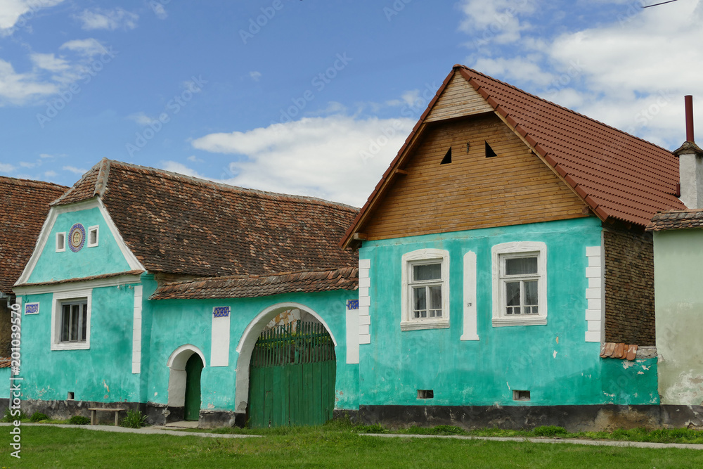 a green painted house in Romania