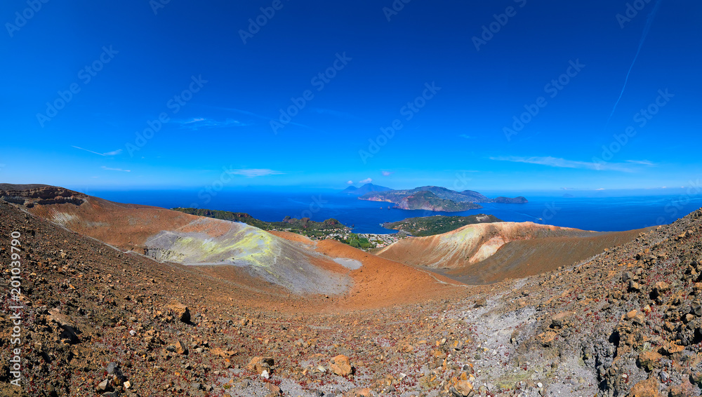View of the volcanic crater and Lipari and Salina islands from the top of the volcano of the Vulcano island in the Aeolian islands, Sicily, Italy
