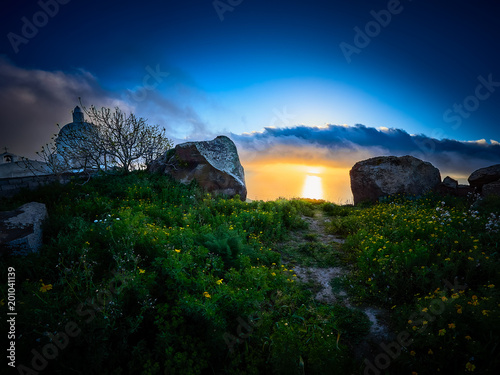 Beautiful sunset at the Old church Chiesa Vecchia di Quattropani in Lipari, Aeolian islands, Sicily, Italy
