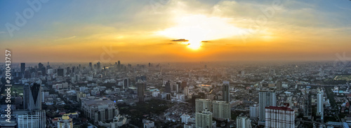 Aerial view of big city at sunset © VladFotoMag