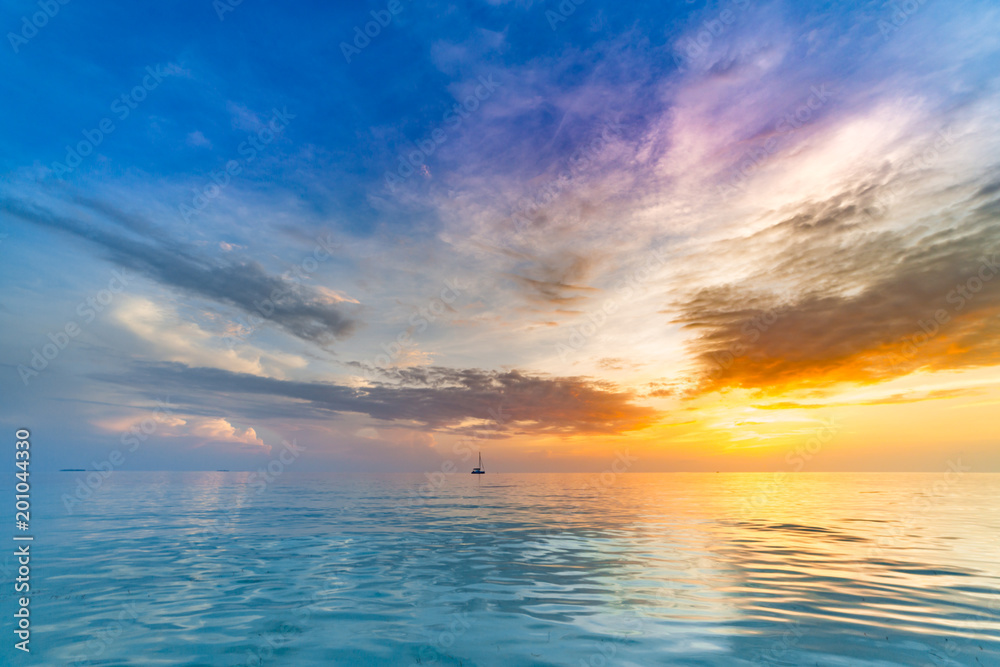 Tranquil sea sky background colorful sunset clouds on the horizon
