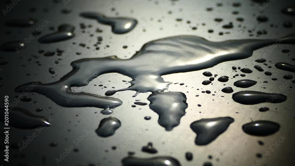 Beautiful drops of water on a black surface. The condensation of water gathered on a dark plane. Reflection of dew. Beautiful drops of water on a black surface. The condensation of water gathered on a dark plane. Reflection of dew.