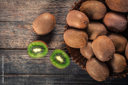 Kiwi fruits on wooden background