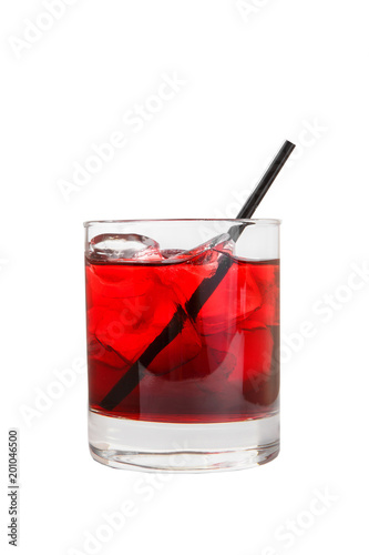 Monochrome transparent cocktail, refreshing in a low glass with a lot of ice cubes with taste of berries, cherries, strawberries, grapefruit with a straw. Side view Isolated white background