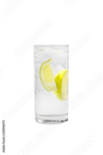 Transparent cocktail in a tall glass with ice cubes with two slices, lime quart, soda, aeration. Side view Isolated white background. Drink for the menu restaurant, bar, cafe
