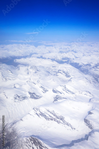 Aerial view of snowy Norway from the plane © Patryk Kosmider