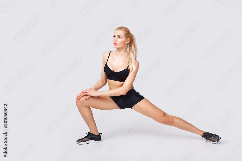 woman in sportswear does exercises