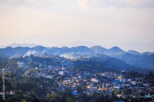 Smoke from controlled burns drifts across the small mountain town of Kalaw, Myanmar