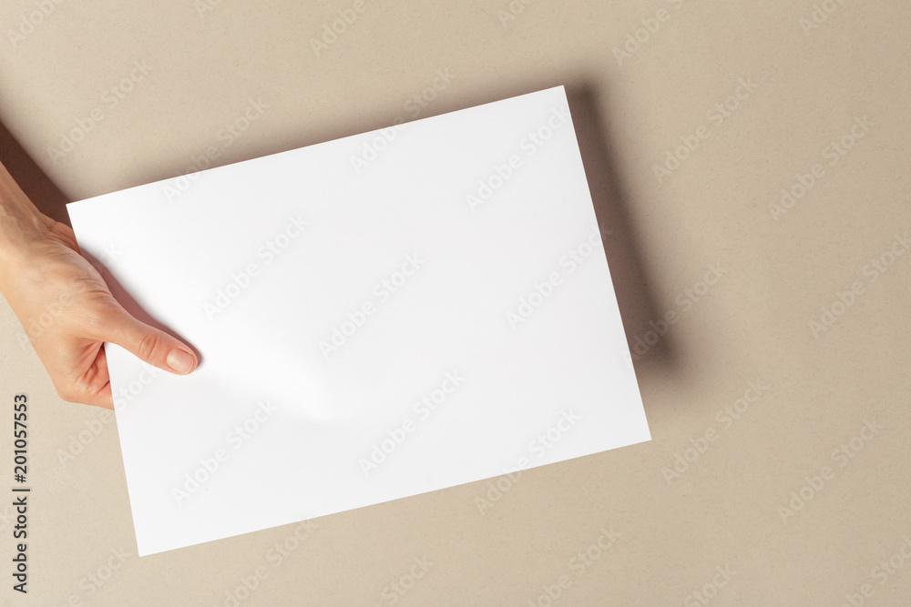 Hand holding papers a4 size Hand holding papers a4 size