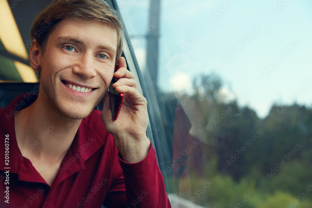 handsome man riding on a train handsome man riding on a train