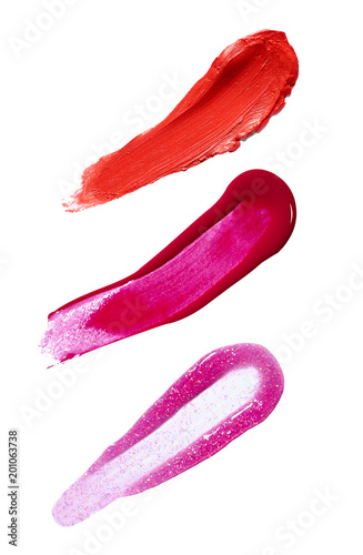 collection of various lipstick and nail polish strokes on white background. each one is shot separately