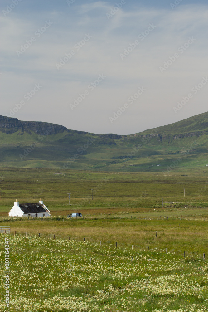 Rural house in scottish highlands with landscape