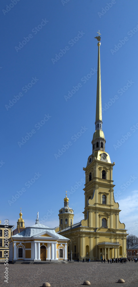 The Peter and Paul fortress in Saint Petersburg, Russia against blue sky. Vertical banner.