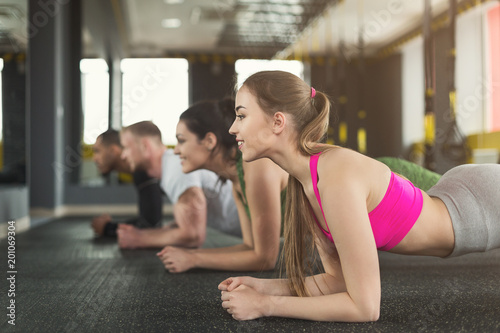 Fitness group plank training indoors