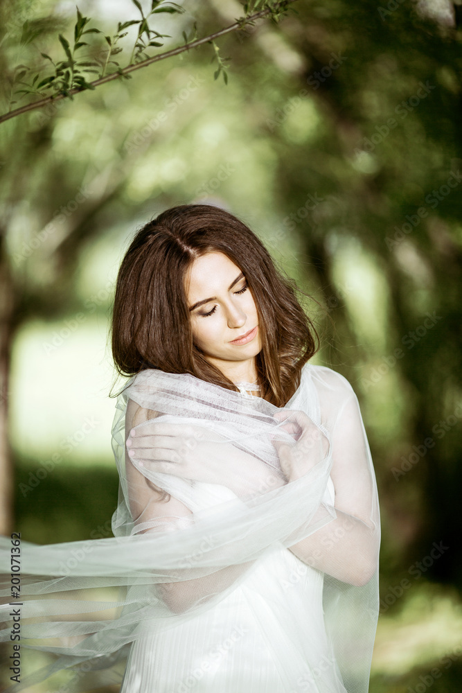 Brunette bride in fashion white wedding dress with makeup Brunette bride in fashion white wedding dress with makeup