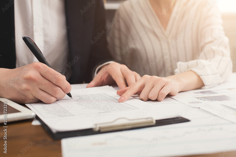 Business colleagues working with documents Business colleagues working with documents