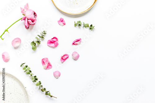 rose petals and plate flat lay on woman desk top view mockup