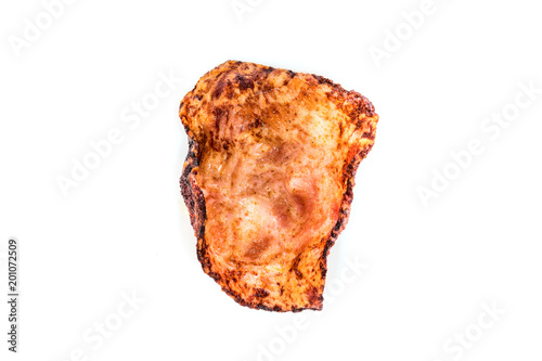 burned sliced ham after fried on white background