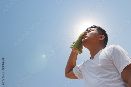 Young man and heat stroke. photo